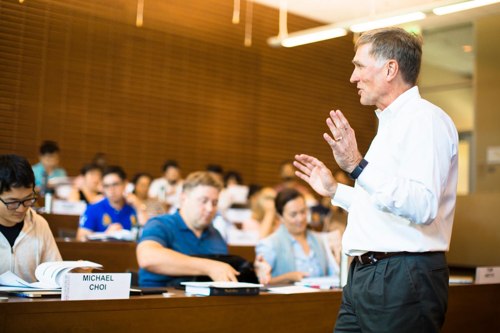 Man speaks to classroom.