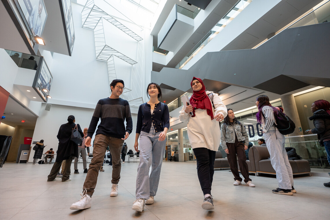 a group of people walking in a building