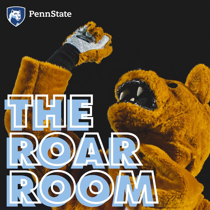 Nittany Lion looking up, fist pump up in the air.