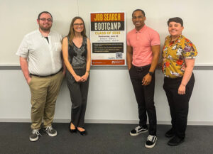 Four career advisors, two on the left and two on the right, stand between a poster that provides information about the Job Search Bootcamp. They are standing in front of a whiteboard.